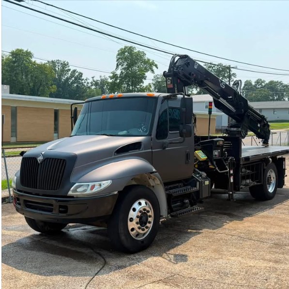 International crane truck wrapped in matte grey with a full chrome delete