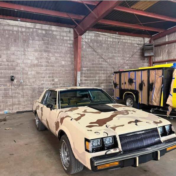 Desert camo printed wrap on a Buick Regal